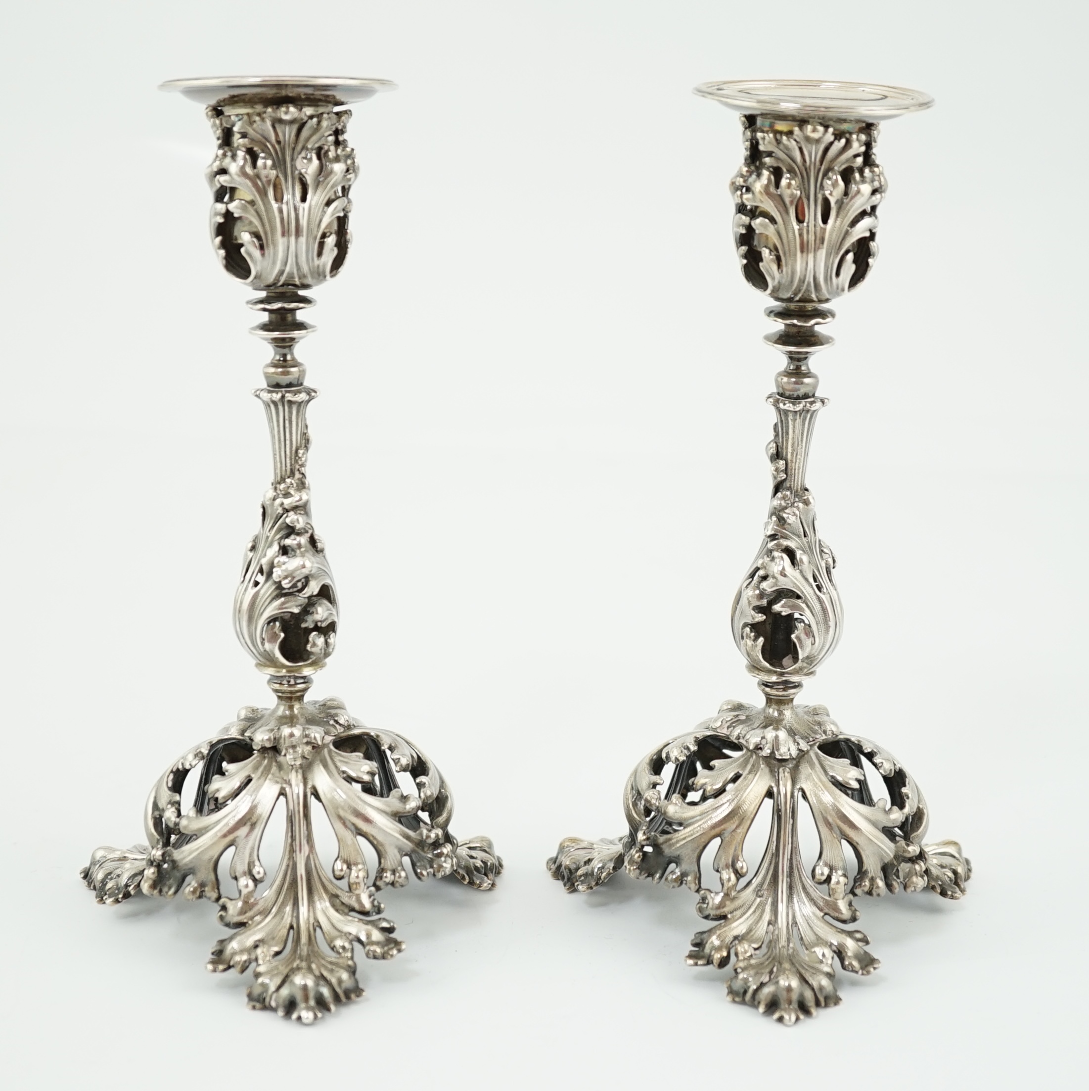 A pair of French pierced 950 standard silver candlesticks